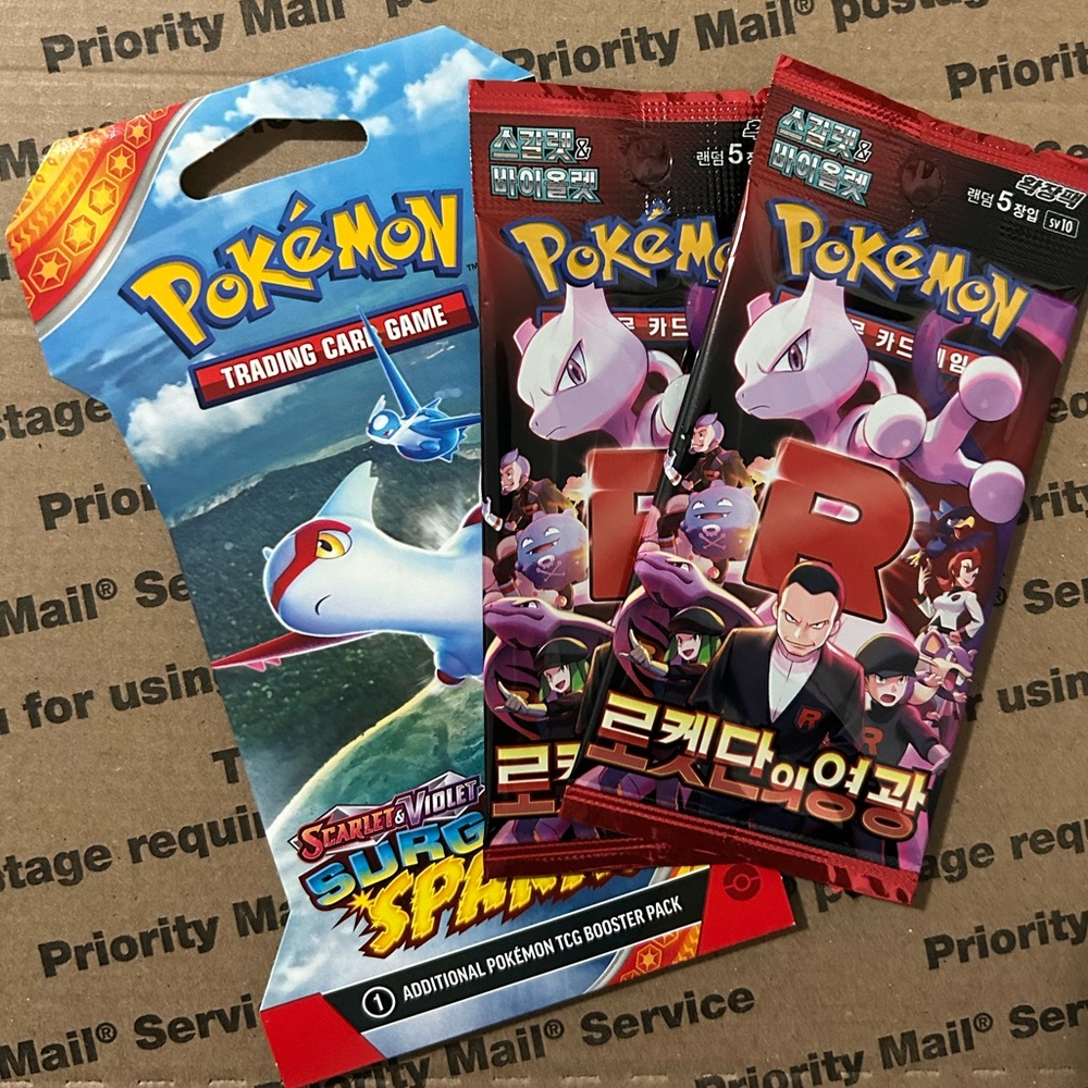 Pokemon TCG: Surging Sparks Sleeved Booster Pack + 2 Glory of Team Rocket Packs